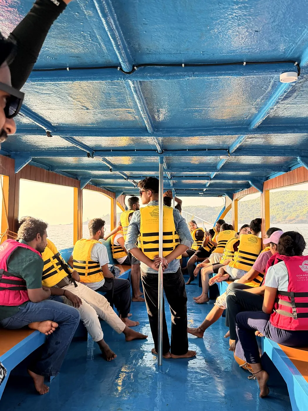 Guests in life jackets boarding the Naavika boat